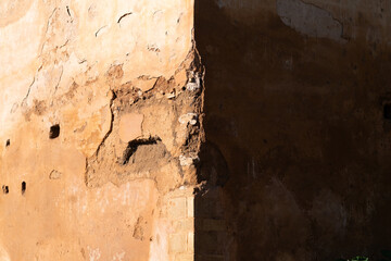 Composition of light and shadow on the wall of the fortified medieval necropolis of Chellah in Rabat, Morocco. A historically and archaeologically significant site