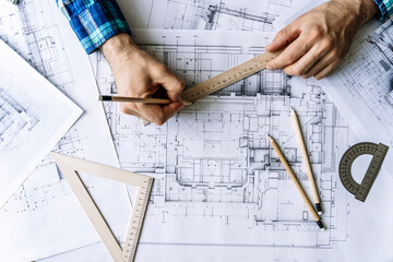 Architectural engineering design plan drawing on the table. Architect's work on table in studio....