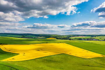 Flowering rapeseed fields from a bird's eye view in Taunus/Germany