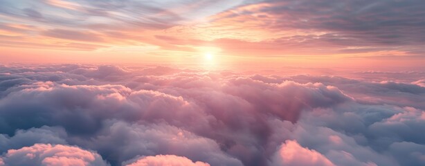 Beautiful sunset and cloudy sky from aerial view. Airplane view above clouds, panoramic banner...