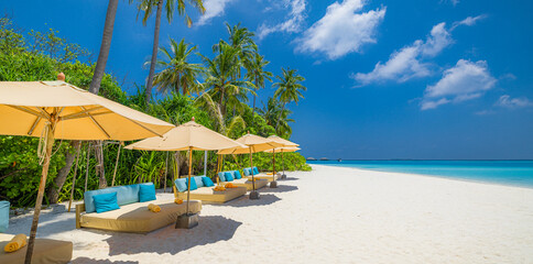 Beautiful carefree beach umbrellas, leisure lifestyle. summer beachfront hotel resort tropical...