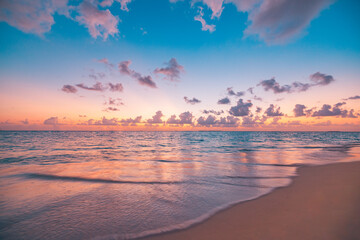 Closeup sea waves beach and colorful sunset sky. Summertime landscape. Empty tropical beach and...