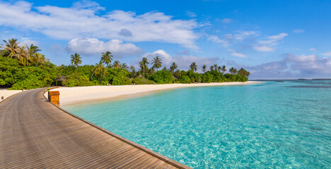 Paradise seaside wooden pier in Maldives. Idyllic tropical beach landscape for background...