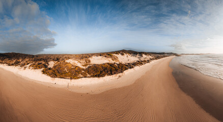 Aerial Drone view One Mile Beach during sunrise sunset with sand dunes. Forster, Great Lakes, Australia - Powered by Adobe