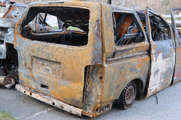 Burnt out and vandalized parked cars in Stockholm. The cars have apparently been here for a while...