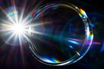 Gold glitter circle of light shine sparkles and golden spark particles in circle frame on black background. Christmas magic stars glow, firework confetti of glittery ring shimmer

