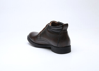 dark brown leather boots isolated on white background