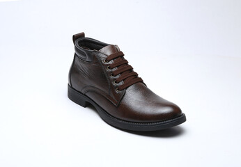 dark brown leather boots isolated on white background