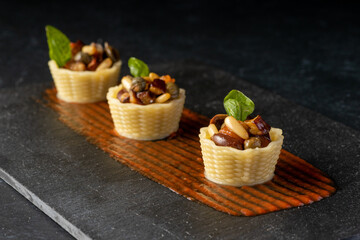 past basket with tomato, pine nuts and basil