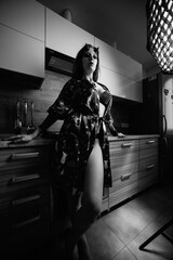 Portrait of a young beautiful girl in the form of a demon. Black and white photo.