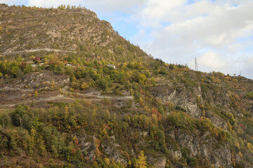 View of snow alp mountain landscape in autumn nature at swiss from the train