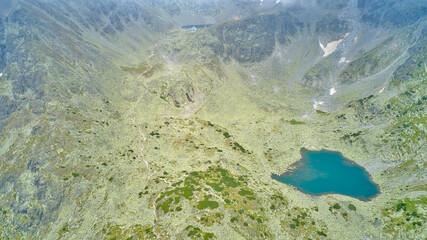Mountain lakes from a drone aerial photography. The highest peak Musala in the Balkans in Bulgaria, height 2925 meters. Mountain lakes, mountain huts and the spirit of travel