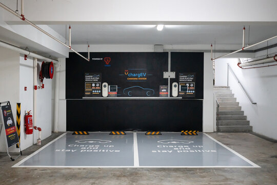 KUALA LUMPUR, MALAYSIA - JUL 07, 2023: ChargEV charging station EV Carpark in apartment. Powered by TNBES