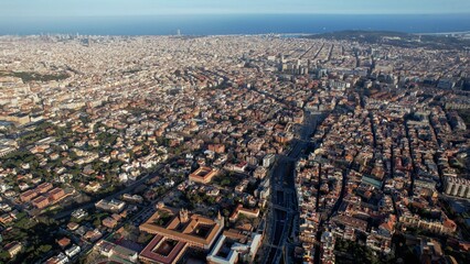 Aerial around the city of Barcelona, Spain on an early sunny morning in spring