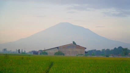 view of Mount Ciremai from a distance in the morning
