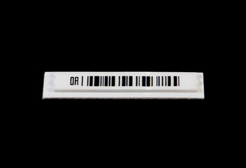 A label with anti-theft barcode on a black background