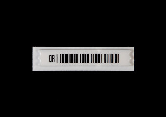 A label with anti-theft barcode on a black background