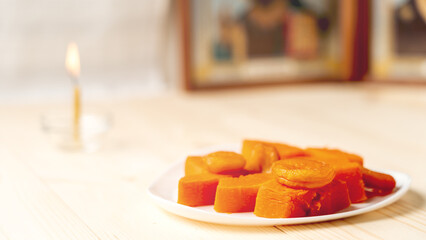 Moscow January 14 2024, End of Great Christian Lent, Holy Week, Pascha. Orthodox bible prayer beads candles, orthodox attributes, concept of Great Lent. Boiled pumpkin, Lenten food during Lent