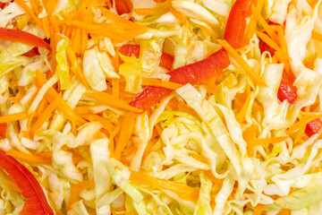 Cabbage salad with carrots and pepper. Food background..