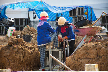 Asian labor people thai labour workers use machine tools and heavy machinery working builder new...