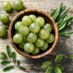 Fotobehang Amla Indian gooseberry fruits with leaves isolated Ai generative. © Tarikulsio