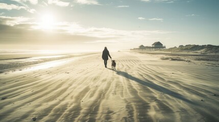 A woman and her dog walking at the beach