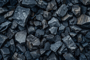 Dark gray rocks on the ground, top view
