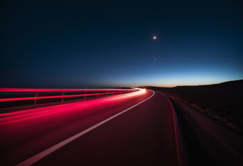Highway at night with light trails.