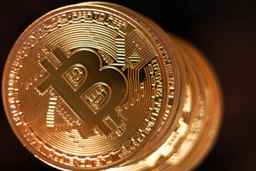 bitcoin coin macro close up on black background with reflection , crypto cryptocurrency btc