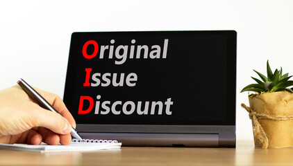 OID original issue discount symbol. Concept words OID original issue discount on beautiful black tablet. Beautiful white background. Business OID original issue discount concept. Copy space.