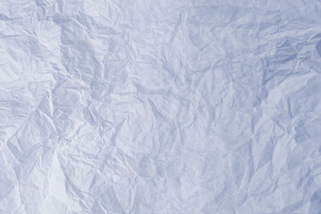 Crumpled white paper background.