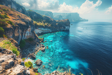 A beautiful seascape with blue water and green cliffs.