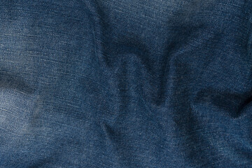 Blue jeans denim texture as a background. Top view.