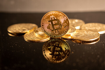 bitcoin gold coin on black background 