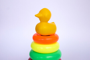 Colorful plastic toy pyramid for kids with white isolated object. Stacking Colourful Soft Touch Rings for Growing Babies,Toddlers.