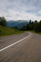 Fototapeta premium Beautiful mountain landscape in early spring and bad road.