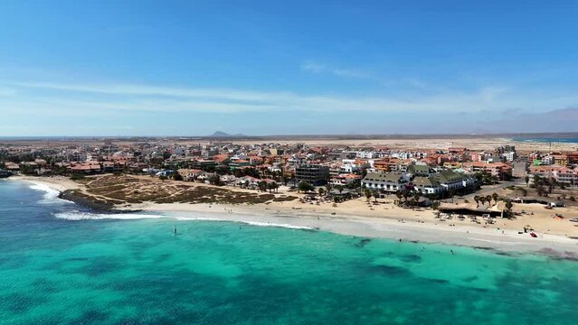 View from above of Santa Maria, Sal, Cape Verde, floating over the sea flying towards the beach
