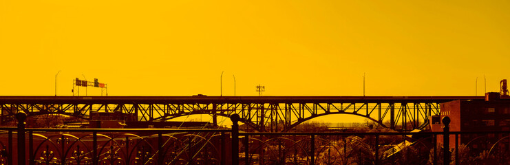 Bridge over Cuyahoga river in Cleveland (OH) USA, at sunset. Panoramic image.