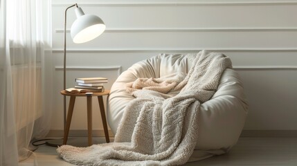 Elegant cozy reading nook with modern armchair, soft blanket, and stylish floor lamp by a wall panel