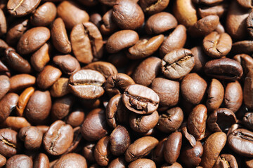 Roasted coffee beans close up background
