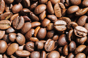 Roasted coffee beans close up background