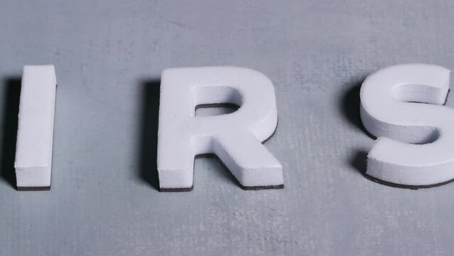 IRS internal revenue service 3d letters close up light blue background