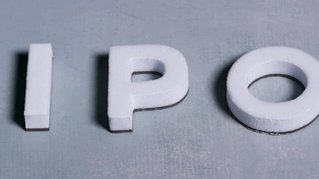 IPO initial public offering 3d letters close up light blue background