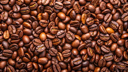 Obraz premium Roasted coffee beans on full frame background. Close-up