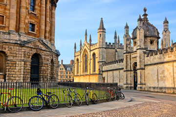 Oxford University at dusk, England, UK. Radcliffe Camera and All Souls College with bicycles on...