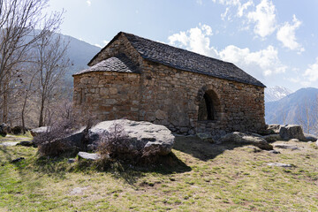 Small Romanesque church on top of a mountain in the Catalan Pyrenees on a beautiful spring morning