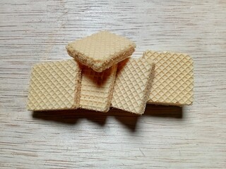 vanilla flavored wafers on wooden background.