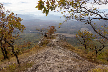 autumn day on the observation deck, mountainous terrain with dried vegetation, panorama of the area