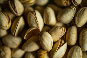 Pistachio nuts. Many pistachios in a pile.