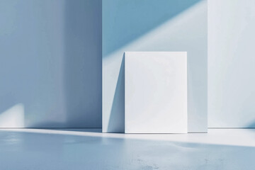 Blank white canvas against a light blue wall with shadows, creating a minimalist and clean mockup for art presentation